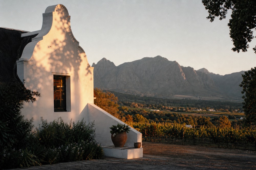 Historic Cape Dutch gable at a Franschhoek wine estate, no text, no logos, no people